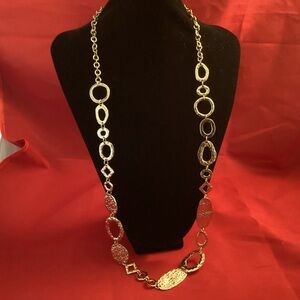 Gold tone metallic parts necklace